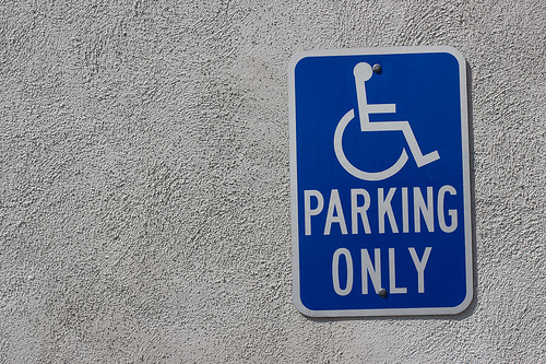 Handicapped parking only sign on textured wall